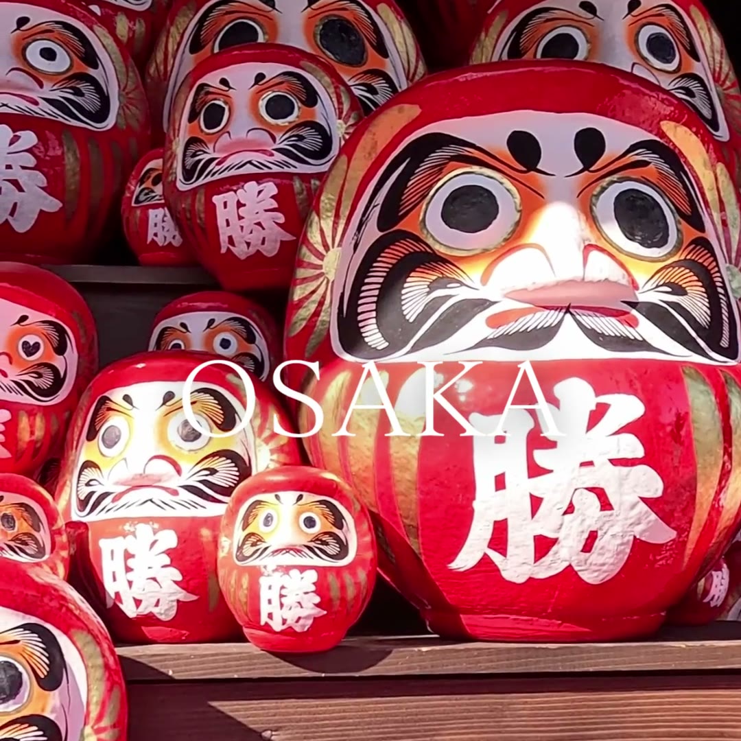 Rows of red winning Daruma dolls